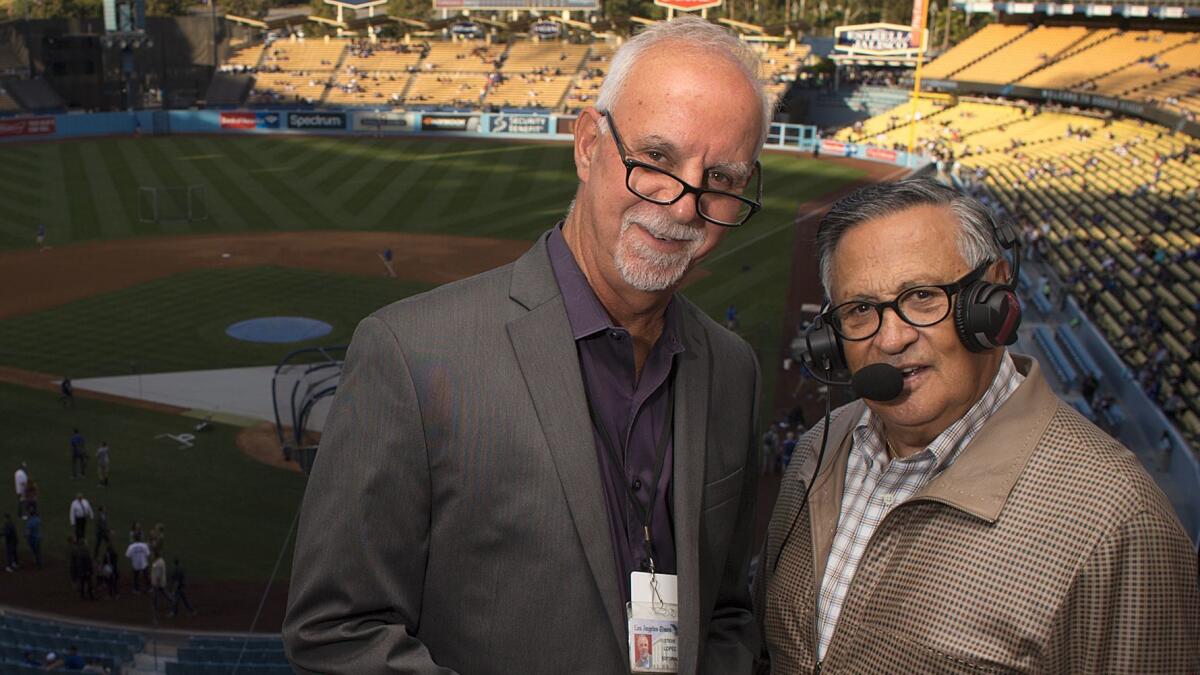 Times Columnist Steve Lopez, left, with his Spanish teacher, Dodgers broadcaster Jaime Jarrin.
