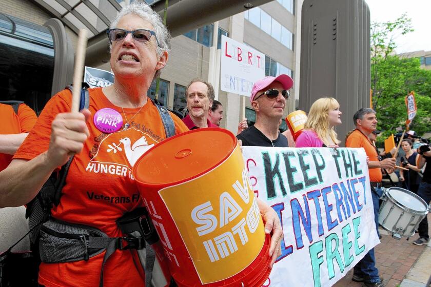 Protesters hold a rally to support "net neutrality" and urge the Federal Communications Commission (FCC) to reject a proposal that would allow Internet service providers such as AT&T and Verizon "to boost their revenue by creating speedy online lanes for deep-pocketed websites and applications and slowing down everyone else," on May 15, 2014 at the FCC in Washington, DC. The FCC commissioners voted on a proposal for protecting an open Internet. AFP PHOTO / Karen BLEIERKAREN BLEIER/AFP/Getty Images ** OUTS - ELSENT, FPG - OUTS * NM, PH, VA if sourced by CT, LA or MoD **