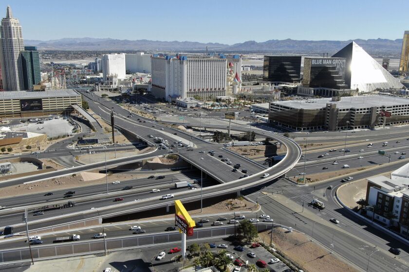 FILE - An aerial view of the interchange at Tropicana Avenue and Interstate 15 in Las Vegas, Tuesday, Feb. 18, 2021. Officials in Nevada say a key stretch of the main freeway between Los Angeles and Salt Lake City will close late Friday, Jan. 27, 2023 until early Monday as part of a project to reshape a busy interchange serving the Las Vegas Strip. (Michael Quine/Las Vegas Review-Journal via AP, File)