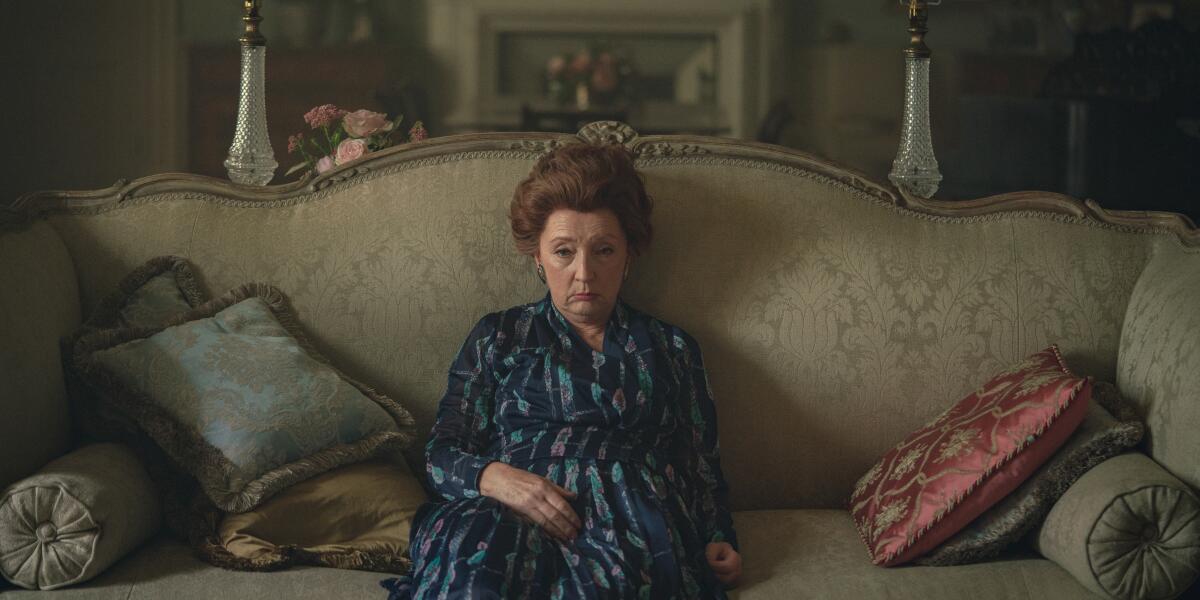 Lesley Manville slumps on a sofa as Princess Margaret in "The Crown."