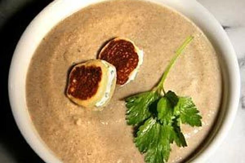 TEXTURE PERFECT: A mixed-mushroom velouté is enriched with just a little cream and topped with buttermilk blini.