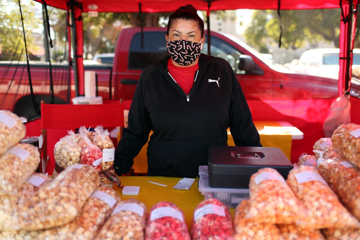 Magda Navarro at her kettle korn stand at a farmers market