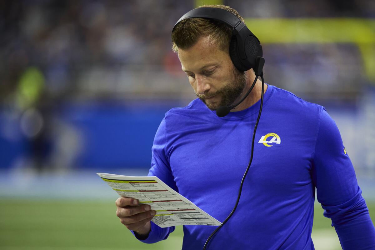 Coach Sean McVay looks at his play sheet during his Rams' season opener against the Detroit Lions.