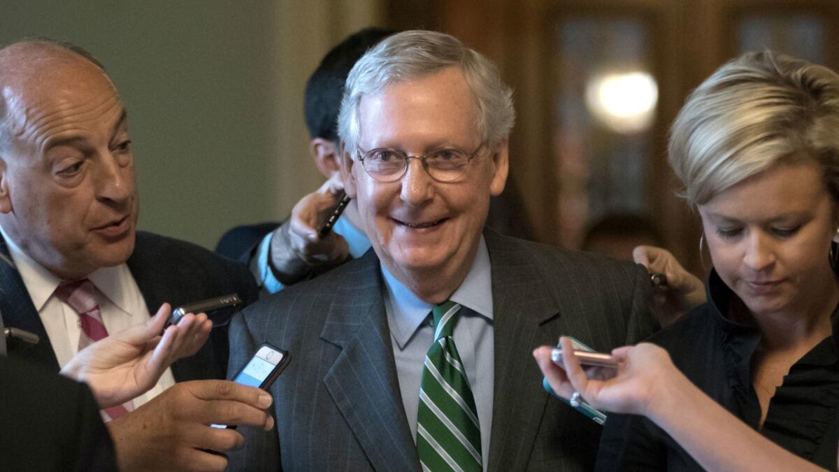 Senate Majority Leader Mitch McConnell smiles after announcing the release of the Republicans' healthcare bill on June 22.