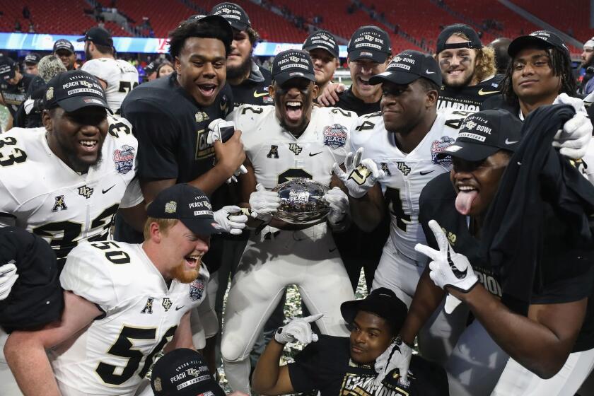 ATLANTA, GA - JANUARY 01: The UCF Knights celebrate defeating the Auburn Tigers 34-27 to win the Chick-fil-A Peach Bowl at Mercedes-Benz Stadium on January 1, 2018 in Atlanta, Georgia. (Photo by Streeter Lecka/Getty Images) ** OUTS - ELSENT, FPG, CM - OUTS * NM, PH, VA if sourced by CT, LA or MoD **