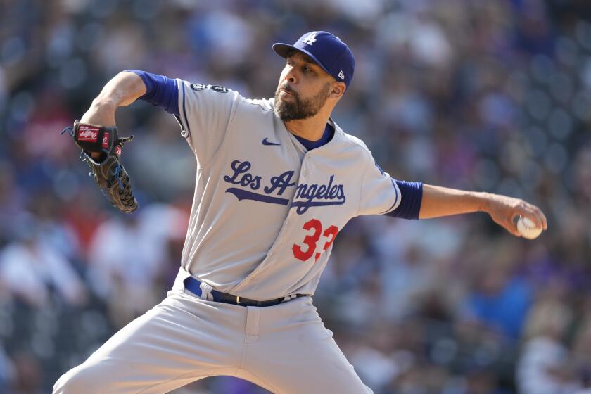 Los Angeles Dodgers relief pitcher David Price works against the Colorado Rockies in the seventh inning of a baseball game Thursday, Sept. 23, 2021, in Denver. (AP Photo/David Zalubowski)