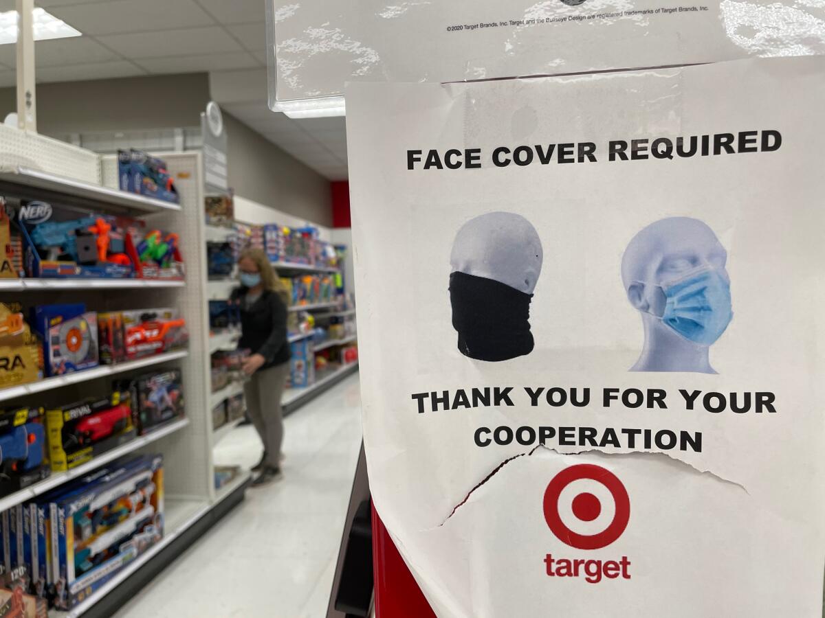 A sign at a Los Angeles Target store tells shoppers that masks are required.