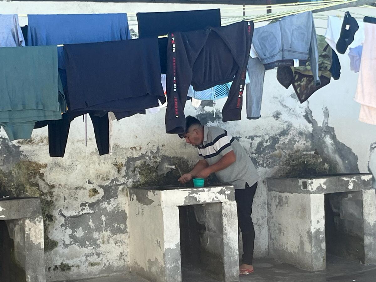 A man doing laundry at the Senda de Vida shelter in Reynosa, Mexico.