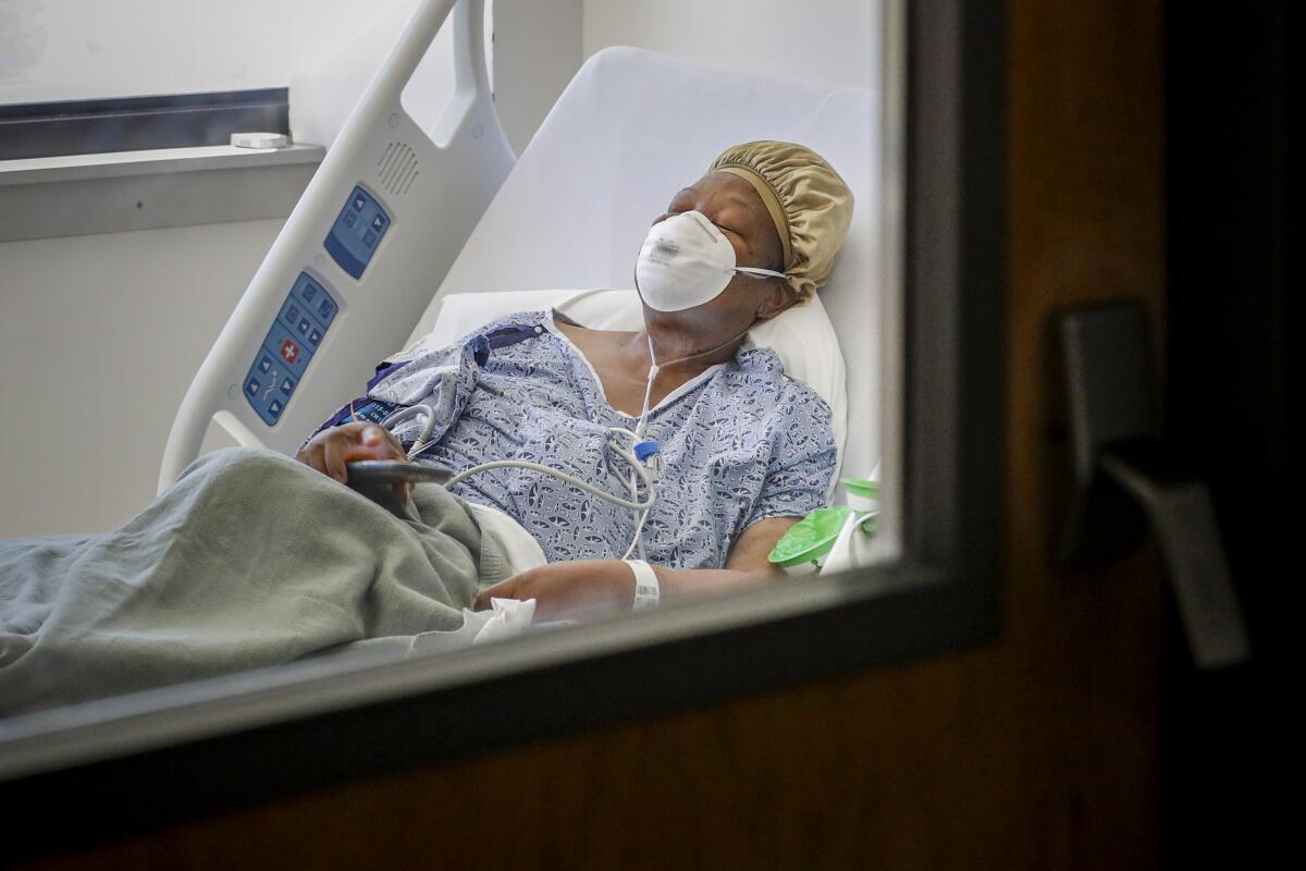 Janice Brown rests in a Victorville hospital, where she is being treated for COVID-19. 