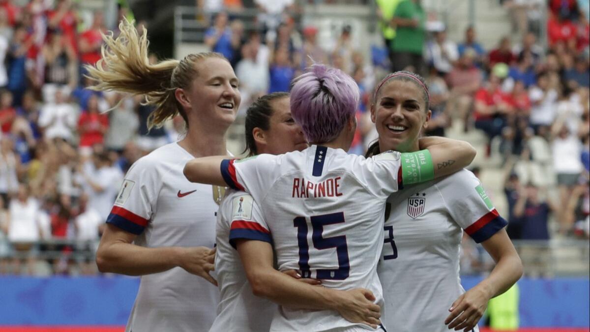 U.S. forward Megan Rapinoe, front, celebrates with teammates after scoring during the opening minutes of a 2-1 victory over Spain at the Women's World Cup on Monday.