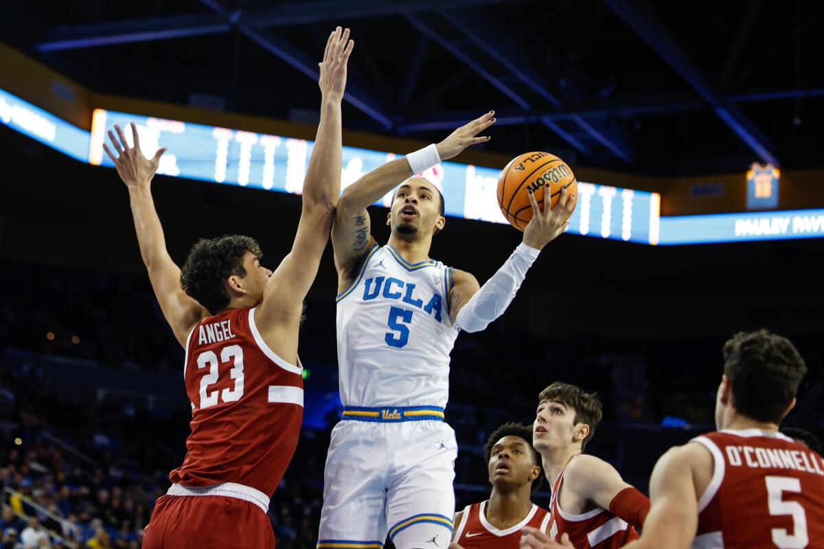 UCLA's Amari Bailey goes up for a shot against Stanford's Brandon Angel.