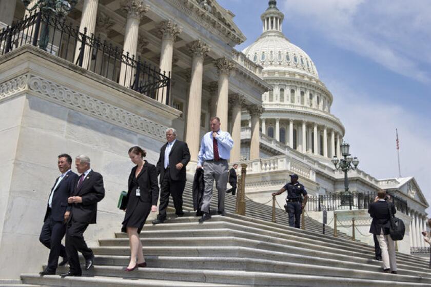 After final votes were cast, members of Congress walked down the steps of the House of Representatives on Capitol Hill in Washington as they left for a five-week recess.