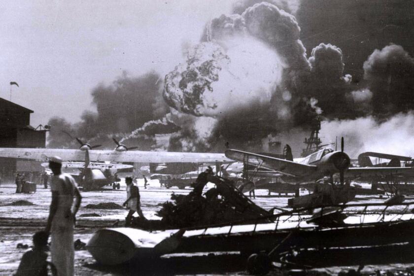 Smoke billows over Pearl Harbor on Dec. 7, 1941, after a surprise Japanese attack.