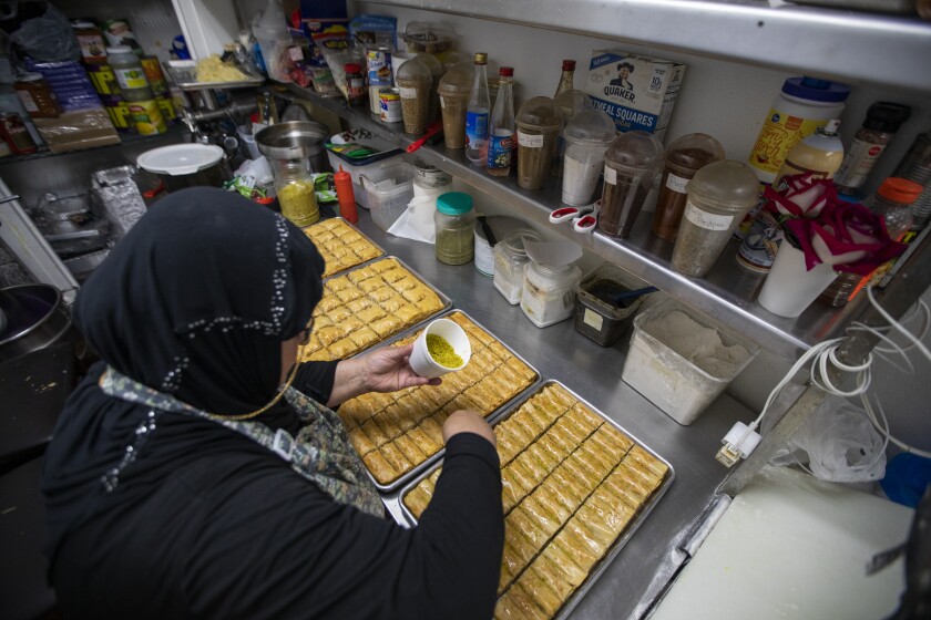 Zeinab Tehfi makes trays of baklava.