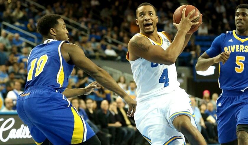UCLA guard Norman Powell (4)drives past UC Riverside guard Steven Jones (10) during their game Wednesday night at Pauley Pavilion.