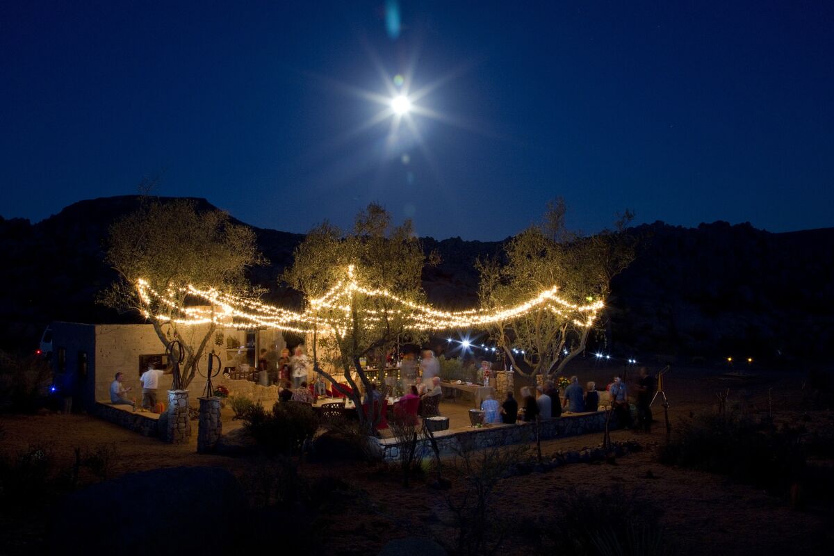 The high desert moon, with assists from string lights and the photographer's shutter speed and aperture setting, captures the glow of Paul Goff and Tony Angelotti's recent summer solstice party at the Ruin.
