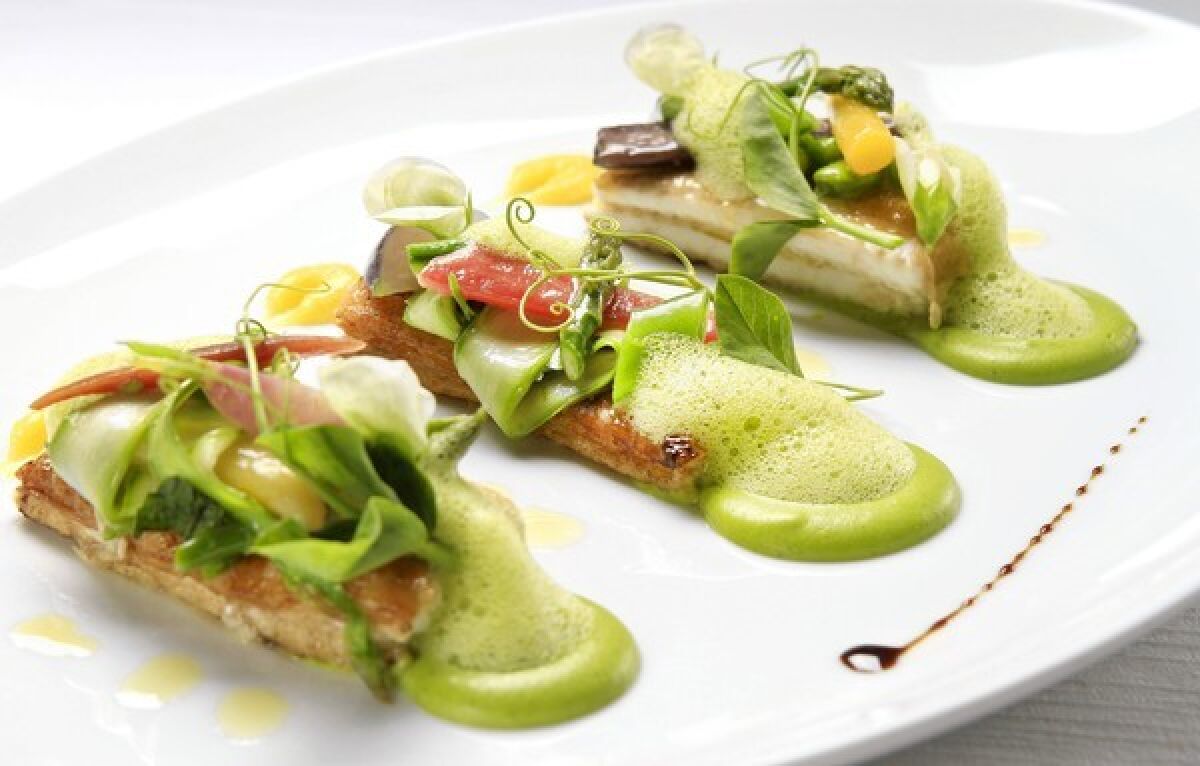 Sauteed dover sole with sugar snap peas, torpedo onions, asparagus, Ligurian olive oil and a garlic emulsion.