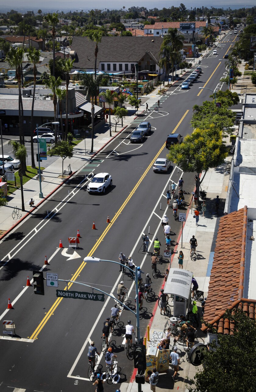 Hundreds ride in North Park’s new protected bikeway, Mayor Gloria pushes to replicate project across city - The San Diego Union-Tribune 3 Mayor Todd Gloria leads bicyclists southbound on 30th Street.