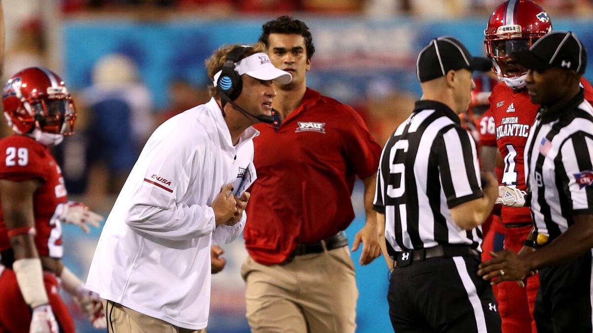 FAU coach Lane Kiffin argues an offensive pass interference penalty with officials during second quarter Friday night.