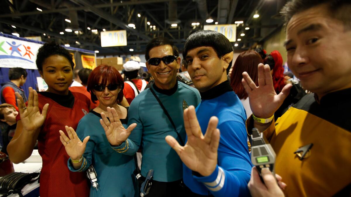 Mamie Stiger, left, Idalia Mejia, Alfredo Garcia Jr., Richard Casillas and Sywa Sung give the Vulcan salute in memory of actor Leonard Nimoy at the Long Beach Comic Expo at the Long Beach Convention Center. "I dressed like Spock," said Casillas. "It was something I had to do."
