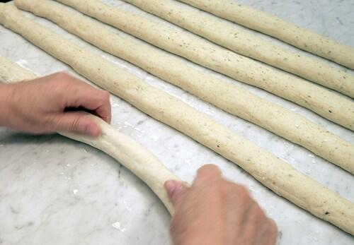 Roll out both batches of dough into three long snakes each, about 32 inches long.