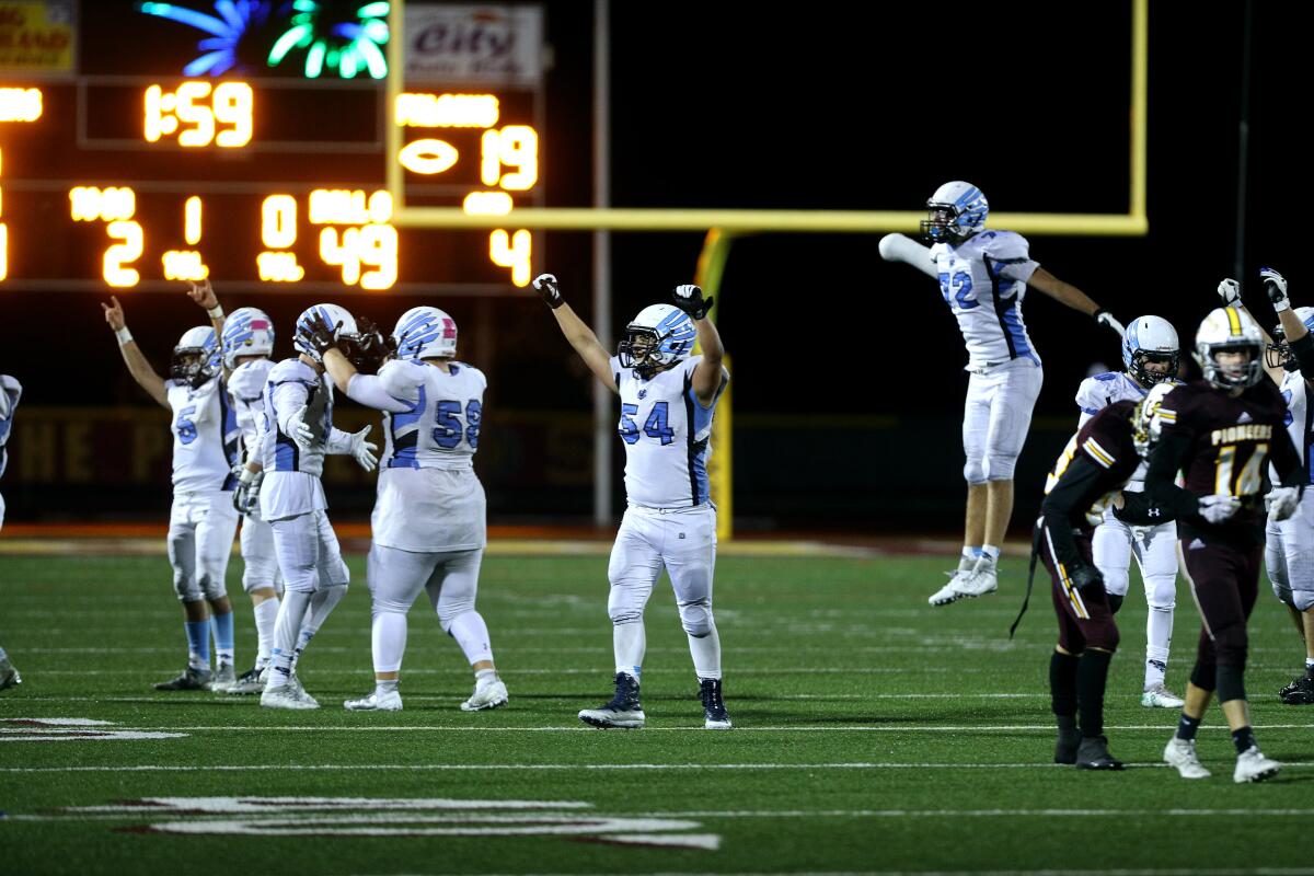 Crescenta Valley celebrates a first down to keep control of the ball at the end of the CIF SS Div. X championship game vs. Simi Valley High, at SMHS in Simi Valley on Saturday, Nov. 29, 2019.