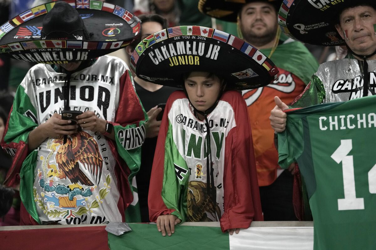 Mexico supporters react after the World Cup group C soccer match against Saudi Arabia.