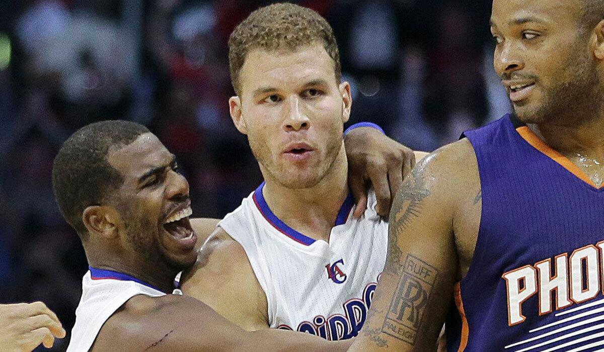 Chris Paul, left, celebrates with Blake Griffin, who hit a game-winning three-pointer against the Phoenix Suns on Dec. 8.