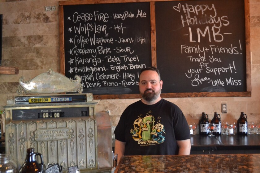 Greg Malkin, operations manager for Little Miss Brewing, stands behind the bar of the latest Poway location. 