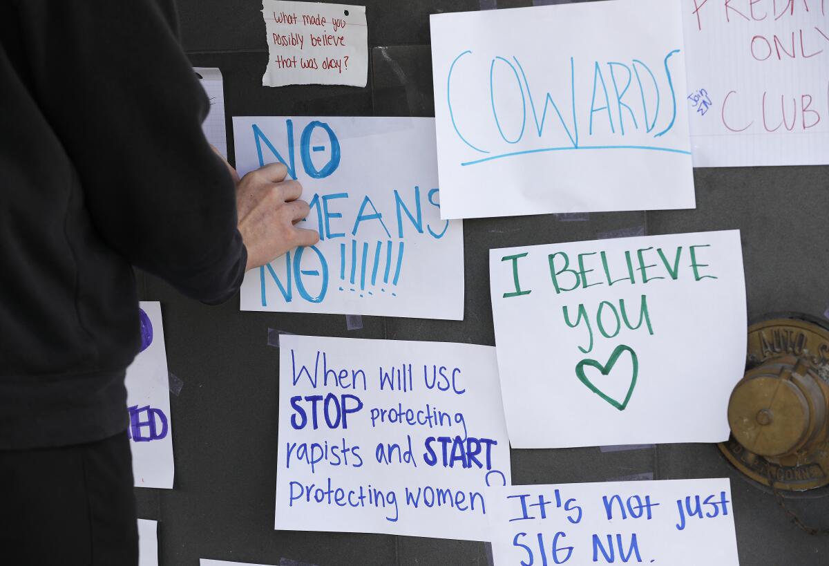 Angry notes plastered on the Sigma Nu fraternity house.  