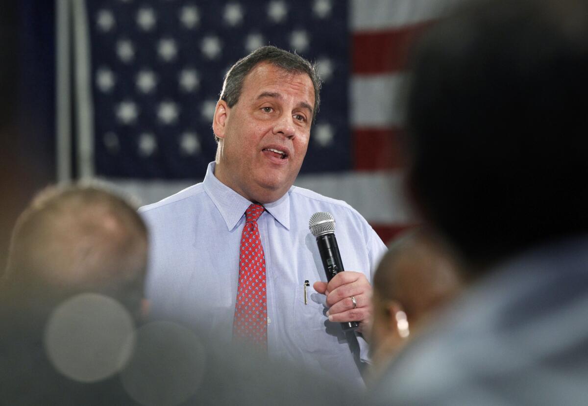 New Jersey Gov. Chris Christie addresses a gathering during a town hall meeting in Brick Township, N.J.
