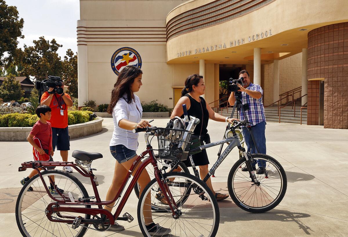 Isabella Gonzalez, 14, left with her mother, Lourdes Mosqueda, right, arrive at South Pasadena High School on Tuesday for final preparations before Isabella starts school as a freshman. Gov. Jerry Brown does not want a school bond on the same ballot with a water bond and Rainy Day Fund proposition, a lawmaker said.