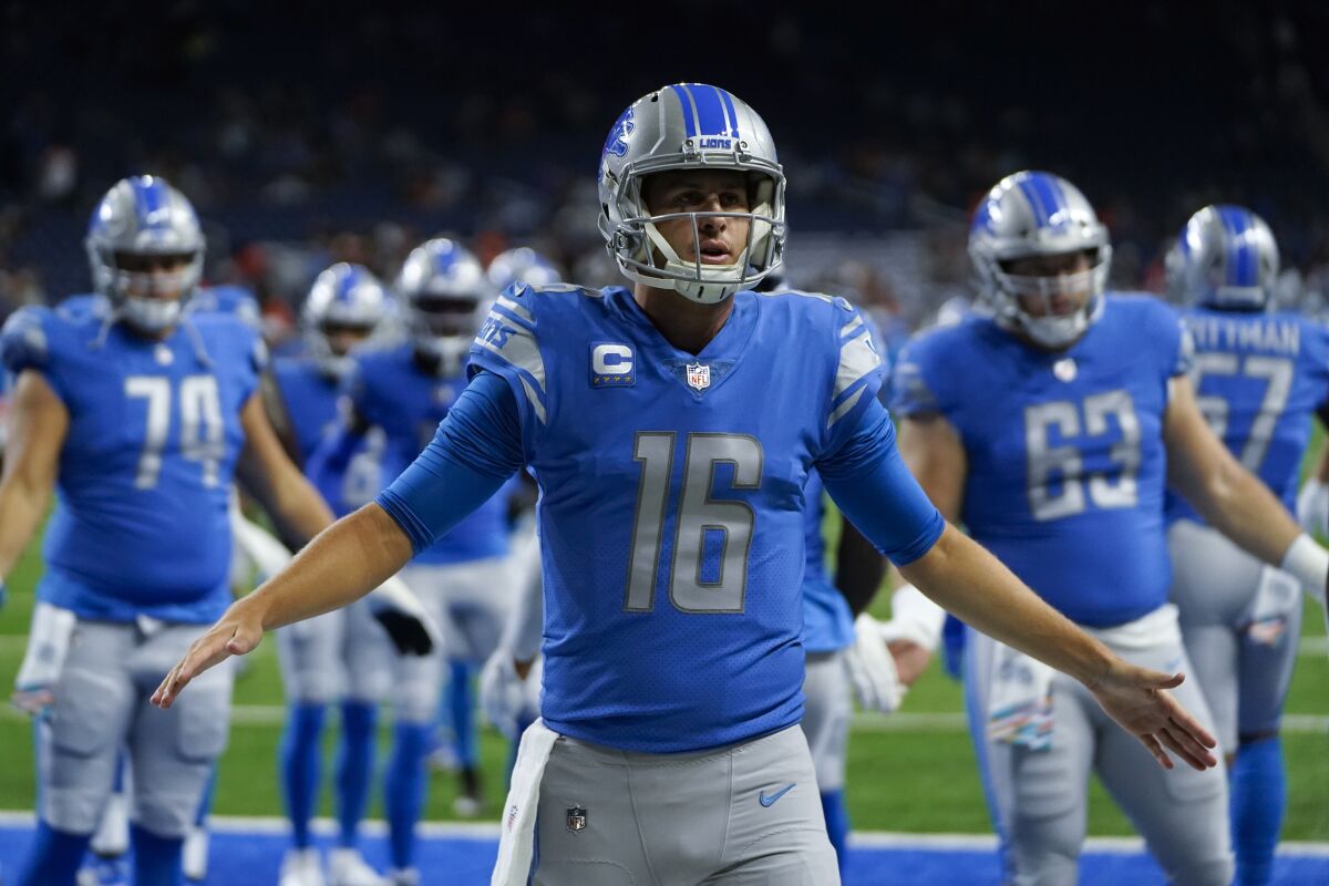 Detroit Lions quarterback Jared Goff welcomes teammates onto the field before a loss to the Cincinnati Bengals.