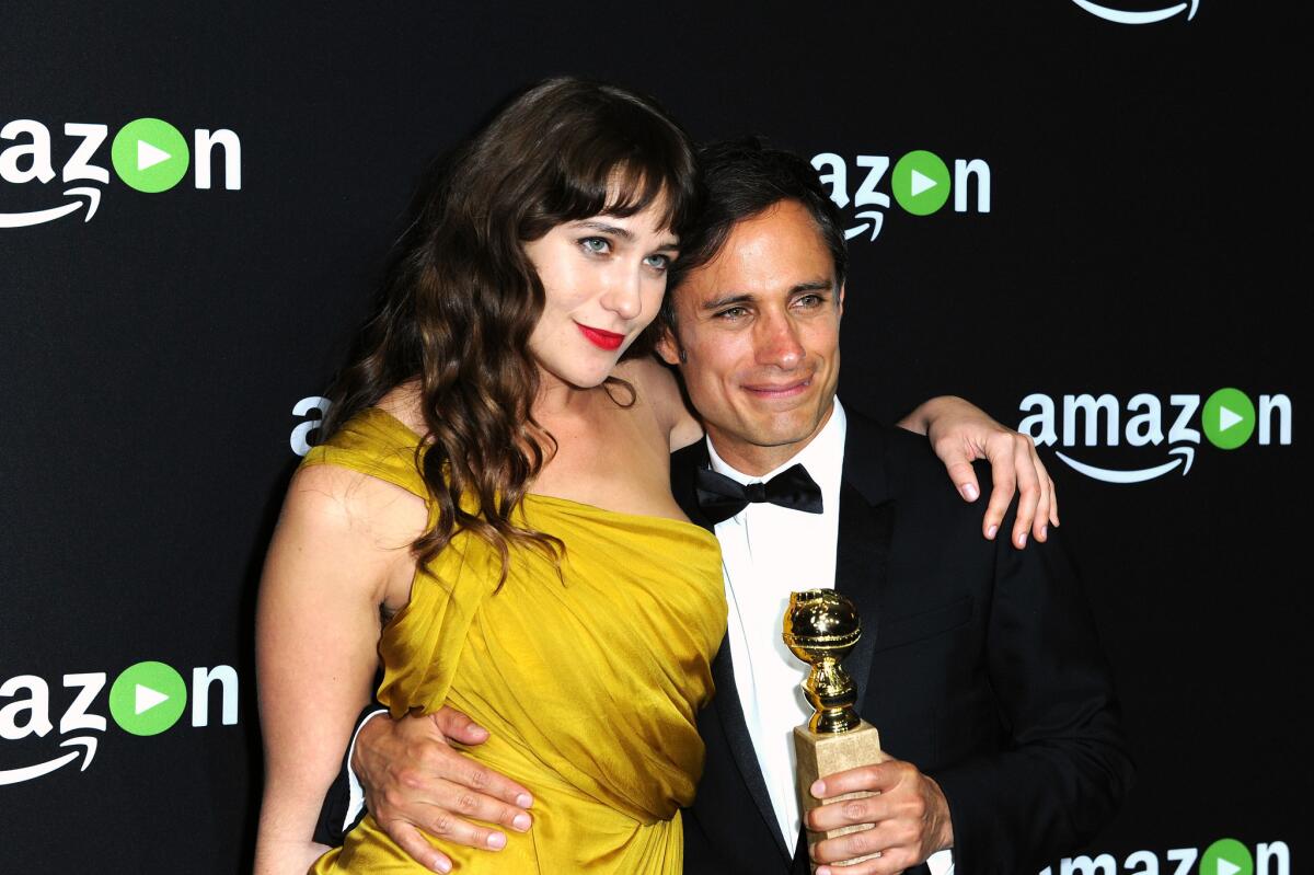 "Mozart in the Jungle" actors Lola Kirke, left, and Gael Garcia Bernal attend Amazon Studios' Golden Globe Awards party at the Beverly Hilton Hotel on Sunday. The show won the Golden Globe for best TV series, musical or comedy and Bernal won the Golden Globe for best actor in a TV series, musical or comedy.