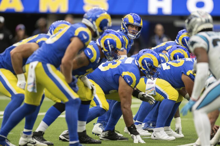 Los Angeles Rams quarterback Matthew Stafford (9) looks on from the scrimmage during an NFL football game against the Carolina Panthers Sunday, Oct. 16, 2022, in Inglewood, Calif. (AP Photo/Kyusung Gong)