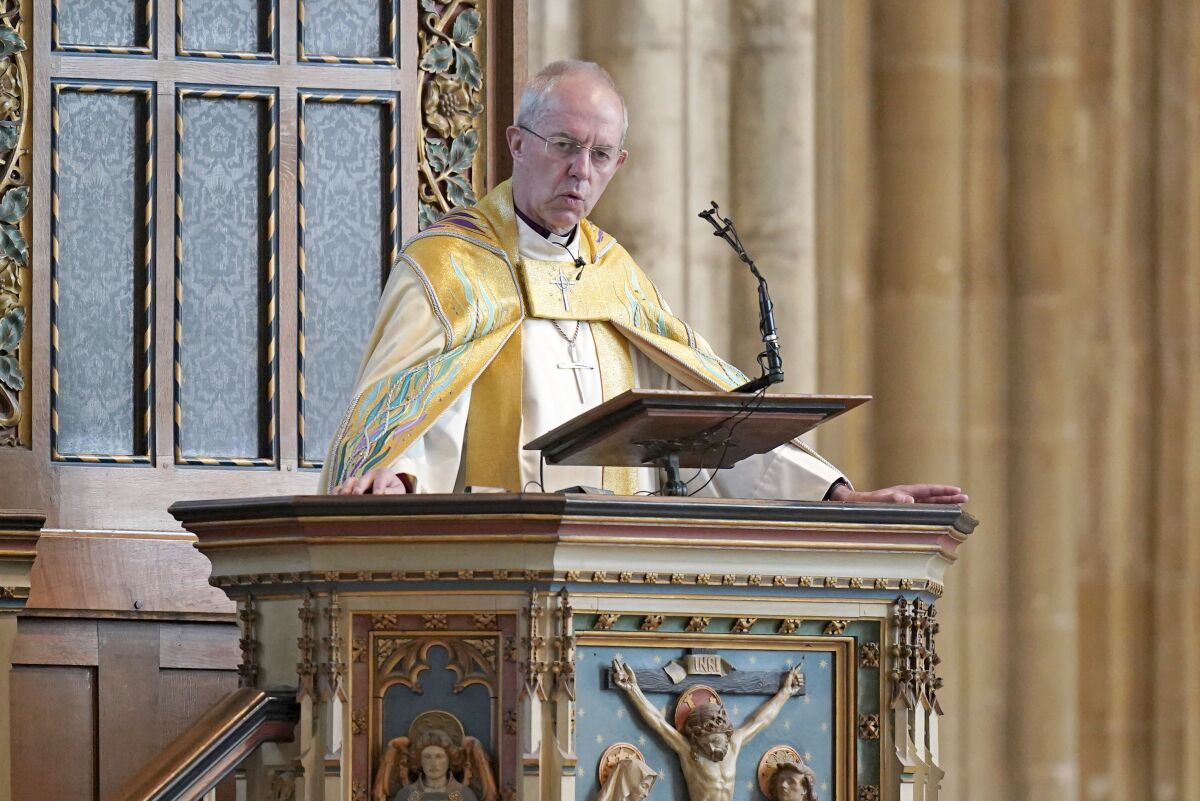 The Archbishop of Canterbury Justin Welby leads the Easter Sung Eucharist at Canterbury Cathedral in Kent, England, Sunday April 17, 2022. The leader of the Anglican church strongly criticized the British government’s plan to put some asylum-seekers on one-way flights to Rwanda, saying “sub-contracting out our responsibilities” to refugees cannot stand up to God’s scrutiny. (Gareth Fuller/PA via AP)