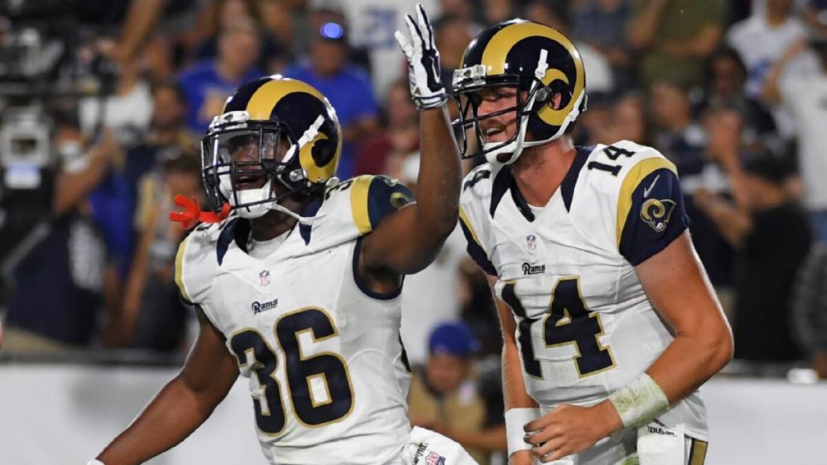 Rams running back Aaron Green (36) celebrates after scoring the go-ahead touchdown on a nine-yard pass from quarterback Sean Mannion (14) on Aug. 13.