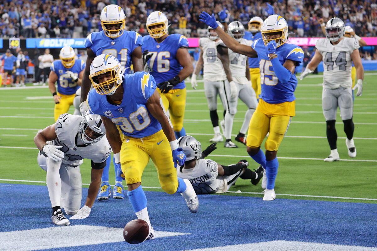 Running back Austin Ekeler (30) of the Los Angeles Chargers celebrates his touchdown against the Las Vegas Raiders.