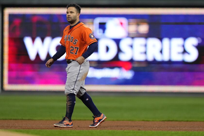 Houston Astros' Jose Altuve walks on the field during the third inning in Game 5 of baseball's World Series.