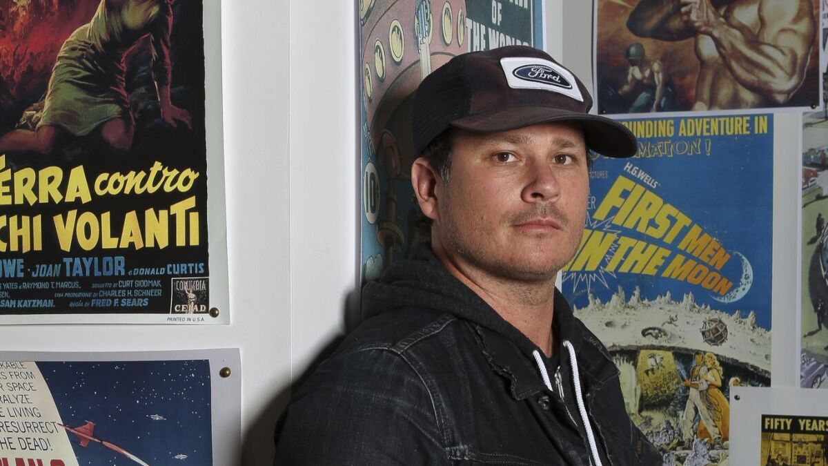 Blink-182 co-founder Tom DeLonge, who is no longer with the band, is shown in his shop, To the Stars, in Encinitas in 2017. An animated series is being produced for TBS based on his graphic novel, "Strange Times." No air date has yet been announced.