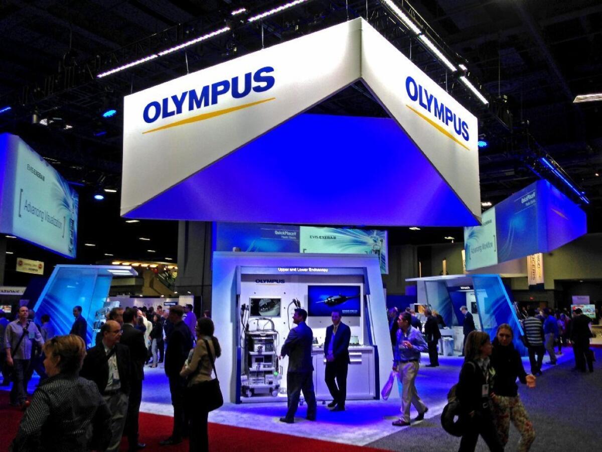 Olympus Corp. makes a specialty endoscope tied to superbug outbreaks at U.S. hospitals. Above, the company's exhibit at a Washington medical conference last year.