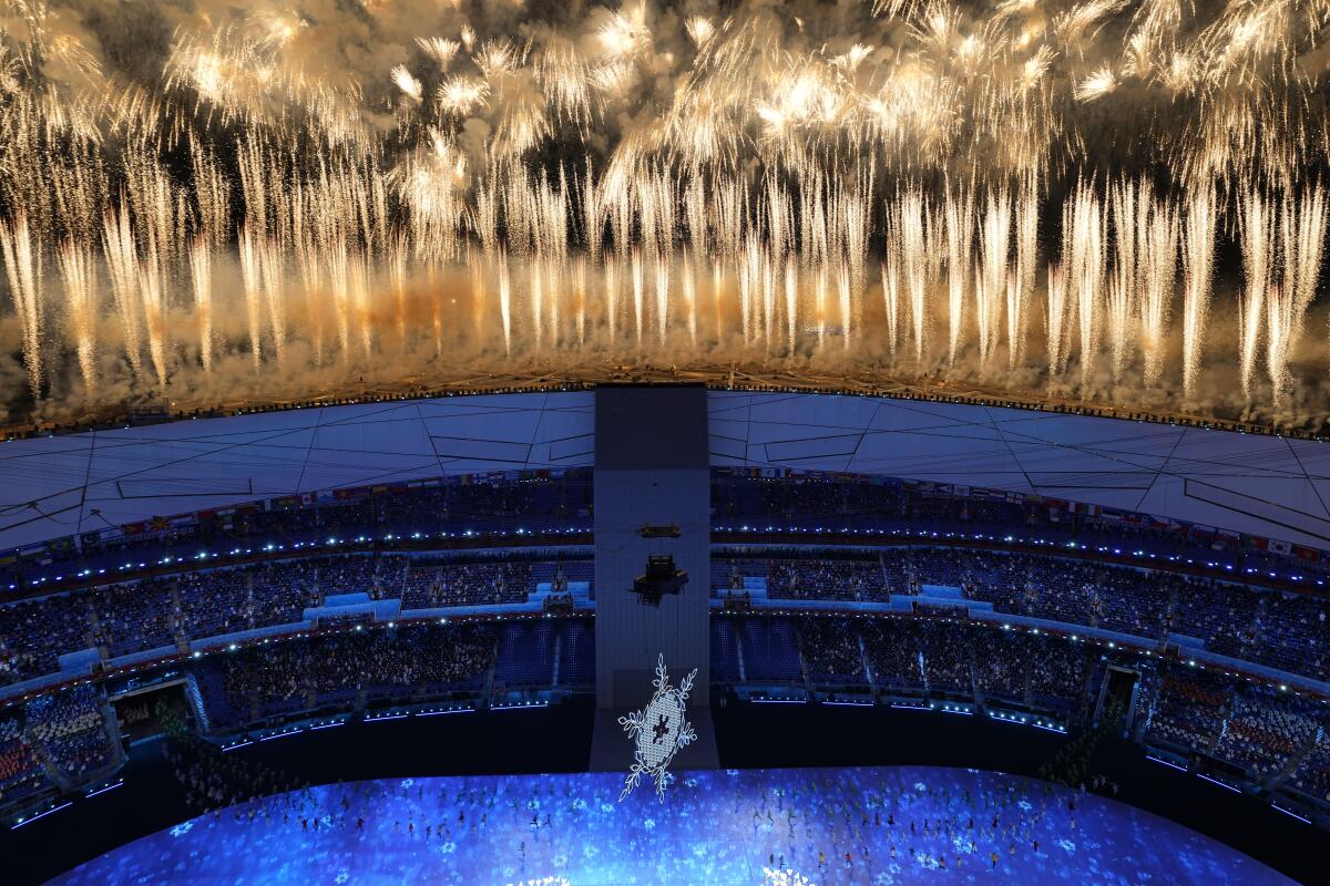 A wall of fireworks over a stadium.