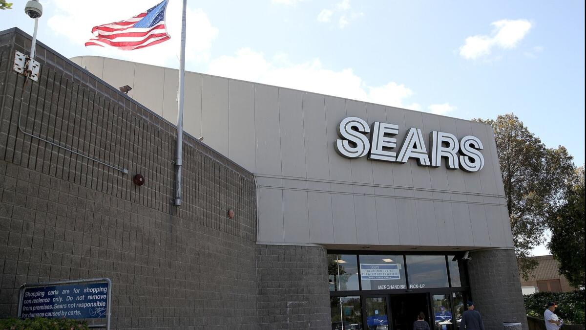 Customers enter a Sears store on May 31 in Richmond, Calif. Sears Holdings Corp. Chief Executive Eddie Lampert has a new plan to save the retailer from bankruptcy.