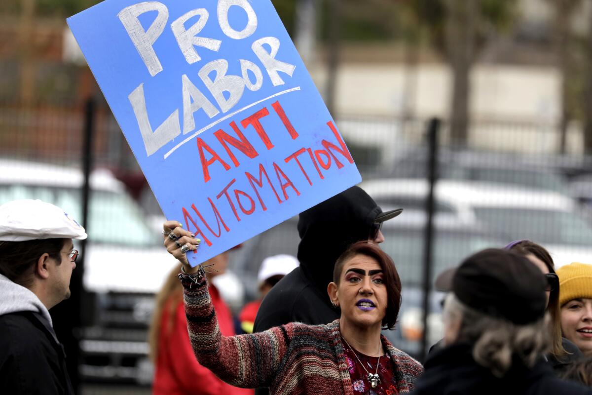 Amber Guido, 39, demonstrates against automation in March.