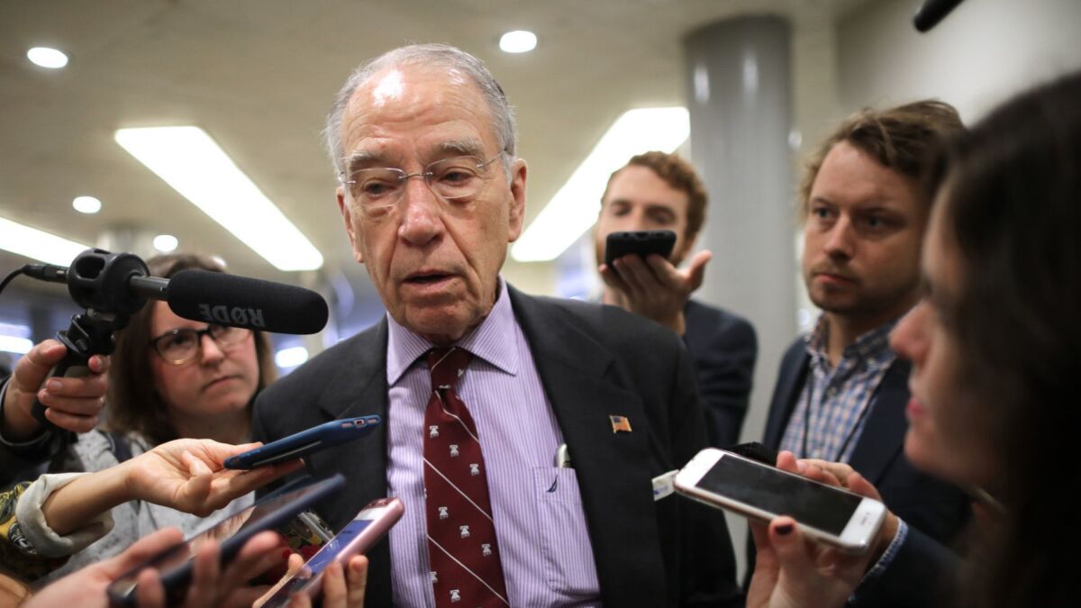 Senate Judiciary Committee Chairman Charles Grassley (R-Iowa) talks with reporters as he heads for a meeting at the U.S. Capitol on Tuesday.