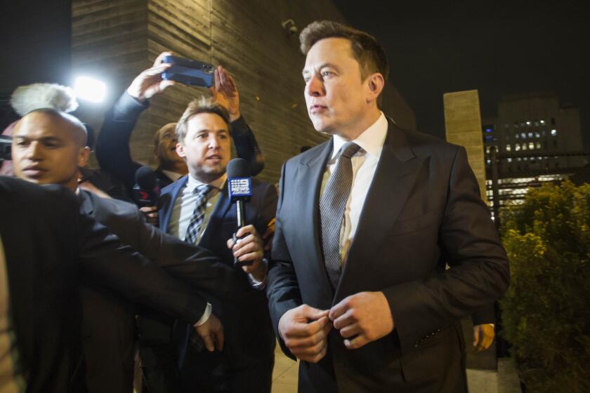 Elon Musk, chief executive officer of Tesla Inc. leaves the US District Court, Central District of California through a back door in Los Angeles. The defamation lawsuit against Tesla CEO Elon Musk began in Los Angeles over calling British cave explorer Vernon Unsworth "'Pedo Guy."