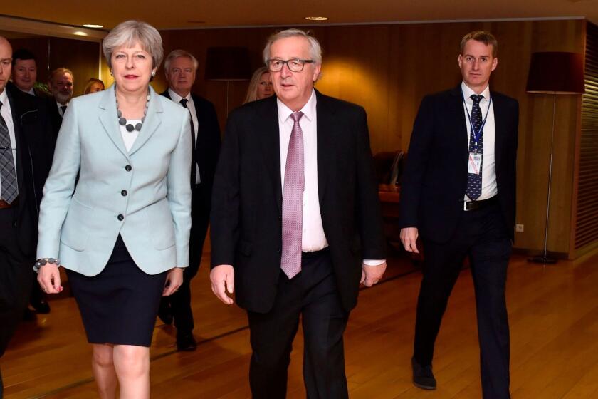 Britain's Prime Minister Theresa May (2-L) and European Commission President Jean-Claude Juncker (2-R) arrive for a meeting at the European Commission on December 8, 2017 in Brussels. Britain and the EU reached a historic deal on December 8 on the terms of the Brexit divorce after the British Prime Minister rushed to Brussels for early morning talks. / AFP PHOTO / POOL / ERIC VIDALERIC VIDAL/AFP/Getty Images ** OUTS - ELSENT, FPG, CM - OUTS * NM, PH, VA if sourced by CT, LA or MoD **