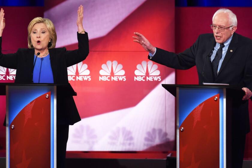 TOPSHOT - Democratic presidential candidates Hillary Clinton (L) and Bernie Sanders (R) participate in the NBC News -YouTube Democratic Candidates Debate on January 17, 2016 at the Gaillard Center in Charleston, South Carolina.. / AFP / TIMOTHY A. CLARYTIMOTHY A. CLARY/AFP/Getty Images ORG XMIT: 600171089 ** OUTS - ELSENT, FPG, CM - OUTS * NM, PH, VA if sourced by CT, LA or MoD **