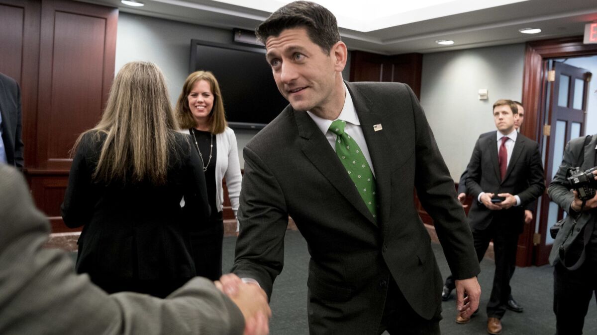 House Speaker Paul D. Ryan (R-Wis.) shakes hands following a roundtable on tax reform on Capitol Hill on April 17.