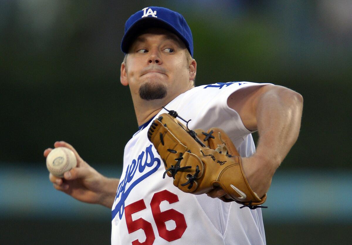 Right-hander Joe Blanton will don a Dodgers uniform once again, this time as a reliever, after signing a one-year, $4-million deal with the team.